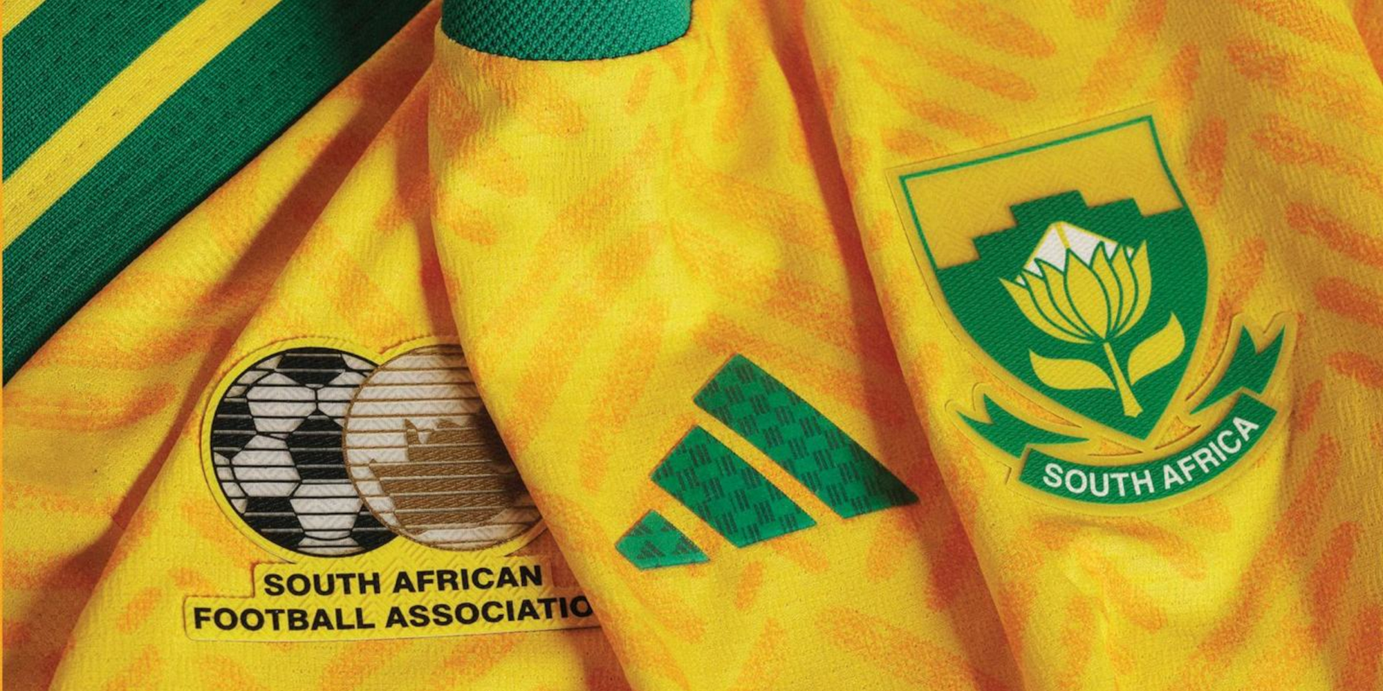 The new 2026/27 yellow and green South Africa home jersey featuring the 12-language woven pattern