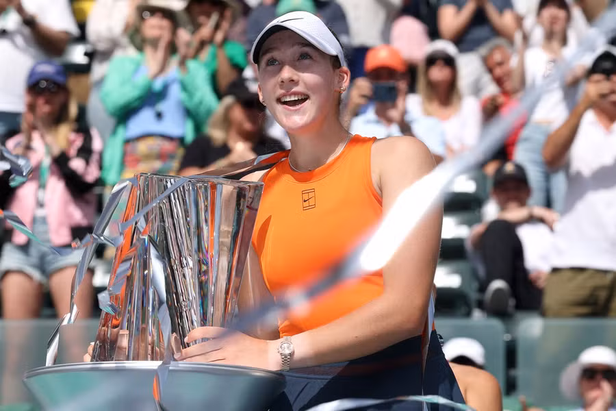 Mirra Andreeva holding the Indian Wells trophy during the 2025 trophy ceremony.