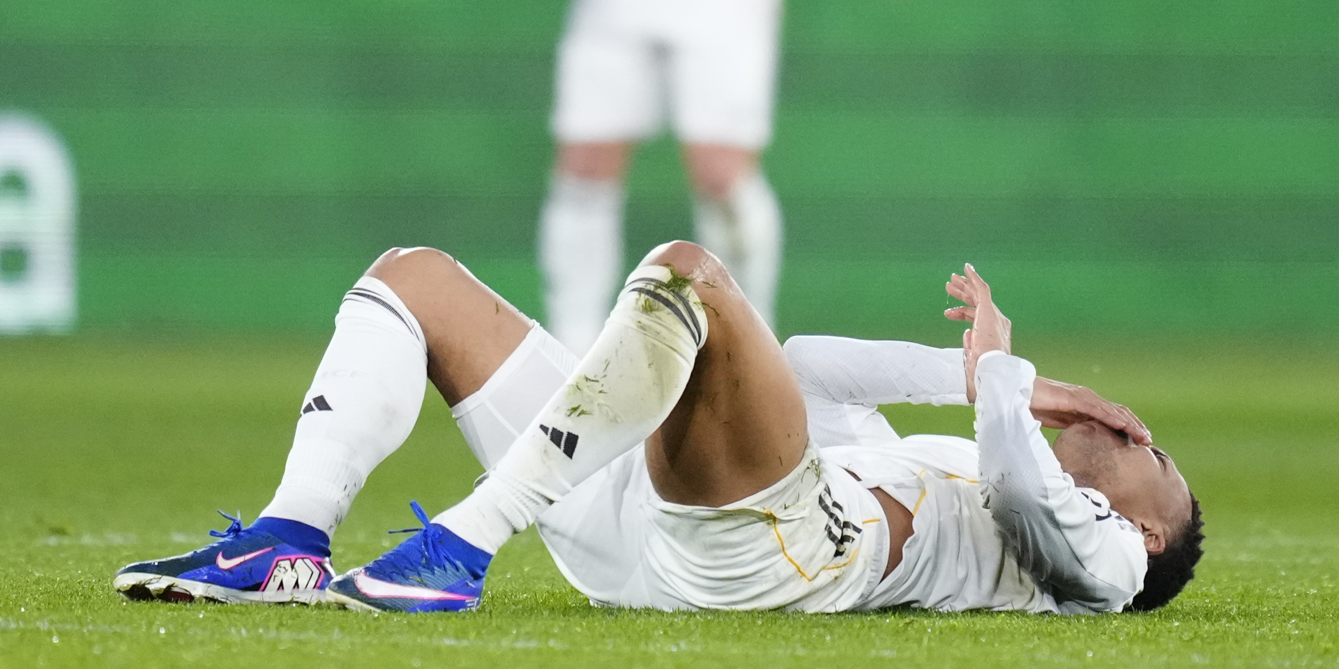 Kylian Mbappé receiving treatment on his knee during a training session.